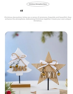 Close-up of wooden Xmas tree and star table ornaments with metal bells and bows