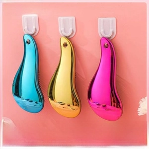 Three-piece set of metallic detangling hairbrushes with ergonomic handles and hanging holes