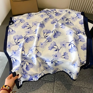 White silk scarf with elegant blue floral print and navy border for women