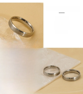 Detail of brushed and polished stainless steel ring with flat wide band design
