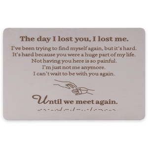 Detailed engraving on brushed stainless steel memorial card with touching message and art