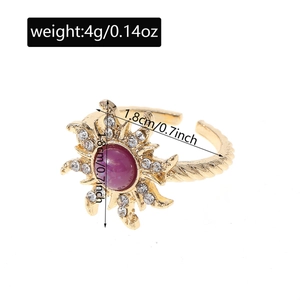 Detail view of gold sunflower ring with purple stone and 1.8cm diameter measurement