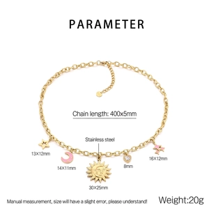Detail view of gold celestial necklace showing dimensions of sun, moon and star charms