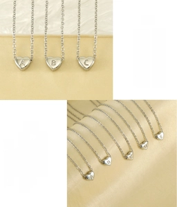 Detailed view of lead-free heart alphabet necklaces with vacuum plated steel finish