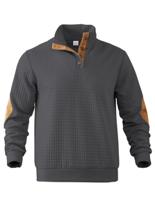 Detail of dark grey quilted sweatshirt with brown elbow patches and half-button collar