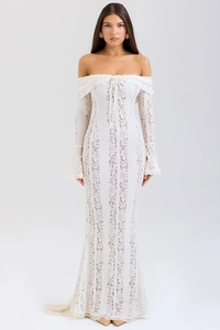 Detail of white lace off-shoulder dress with bell sleeves and mermaid silhouette