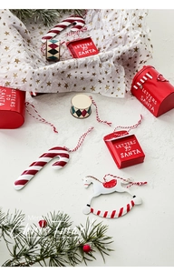 Festive metal Santa mailbox and Christmas ornaments on snowy background decoration
