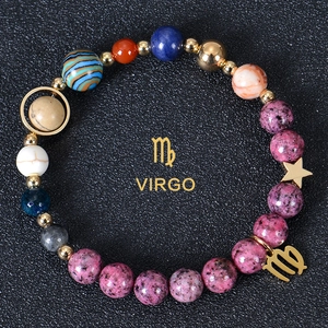 Detailed view of Virgo zodiac bracelet with blue natural stones and gold charms