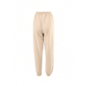 Rear view of beige drawstring joggers showing high-quality knit cotton fabric texture