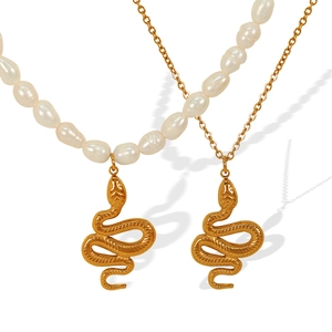 Retro titanium steel layered necklace featuring natural freshwater pearls and golden snake pendant