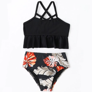 Two-piece girls bikini set with black ruffle top and tropical palm leaf print high waist bottoms