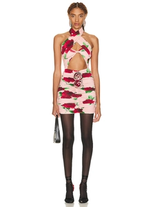 Detail of pink rose print mini dress with halter neck and 3D floral waist embellishments