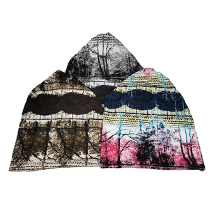Three stylish beanies with landscape forest prints in black, brown, and pink colors