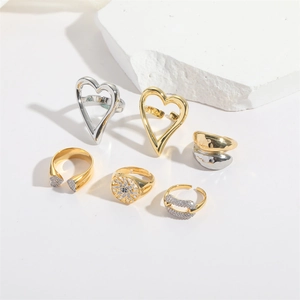 Set of 6 minimalist chunky heart rings with blue gemstone and polished metal finish