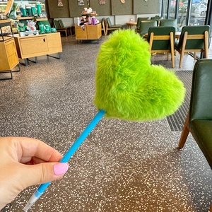 Plush heart ballpoint pen with green faux fur top and blue plastic barrel design