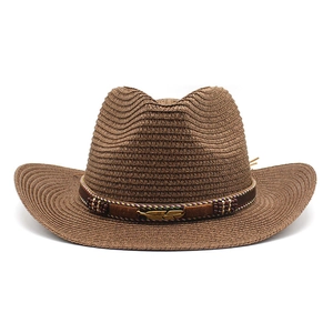 Brown woven cowboy straw hat with wide brim and decorative metal feather belt