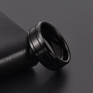 Minimalist black tungsten ring for men featuring polished mirror finish and double grooves