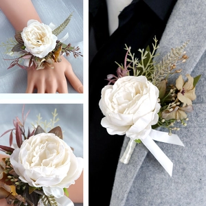 Elegant white faux rose boutonniere and wrist corsage set for wedding celebrations