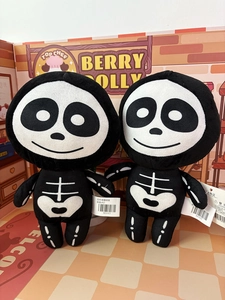 Detail view of two 20cm black and white cartoon skeleton plush dolls for Halloween gifts