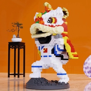 Close-up of a Lion Dance astronaut building block pen holder on an orange background
