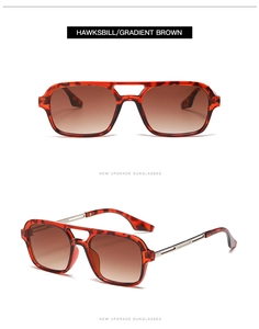 Detail view of tortoiseshell sunglasses with metal arms and gradient brown lenses
