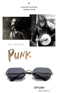Vista frontal de gafas punk con montura de metal dorado y cristales oscuros de moda