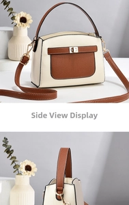 Detail view of two-tone beige and brown small square bag with litchi grain texture