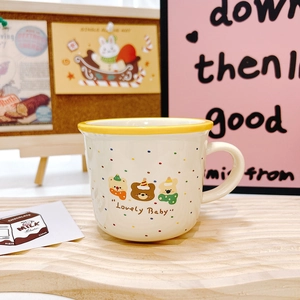 Close-up of a white ceramic mug featuring Lovely Baby cartoon bears on a wooden tray