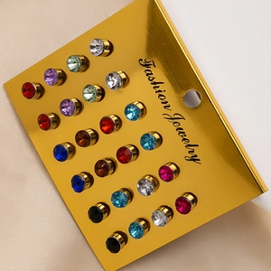 24-piece set of colorful rhinestone stud earrings arranged on a gold display card
