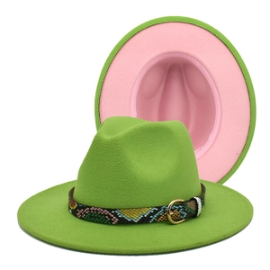 Two-tone fedora hat in bright green with pink lining and snake print belt accessory