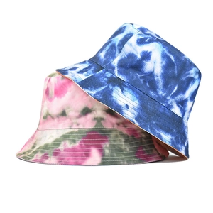 Colorful tie-dye bucket hats in blue-white and multi-color patterns for fashion styles