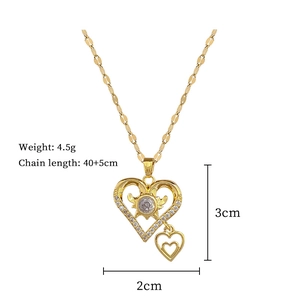 Detailed view of golden heart pendant with dimensions 3x2cm and 40+5cm chain length