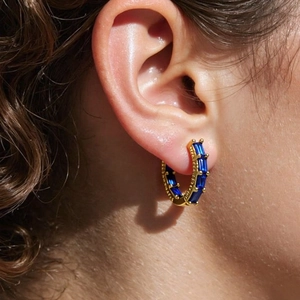 Elegant 18K gold-plated hoop earrings featuring rectangular-cut blue cubic zirconia stones