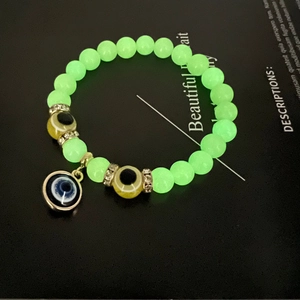 Glow-in-the-dark beaded bracelet with Turkish evil eye charm and crystal accents