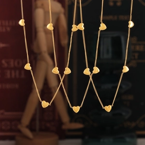 Minimalist 18K gold plated heart necklace featuring multiple 3D heart charms on a chain