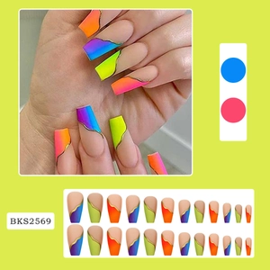 Detail of neon gradient coffin press-on nails with golden line accents and matte finish