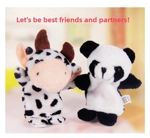 Detail of soft plush panda and cow finger puppets for early childhood interaction