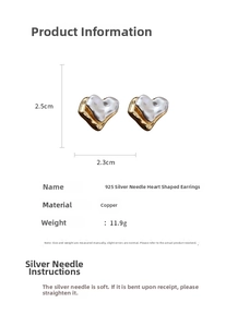 Detail view of irregular gold and silver heart earrings with size 2.5cm by 2.3cm
