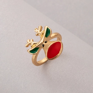 Detailed view of reindeer ring with red nose and green enamel antlers on gold band