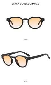 Detail view of vintage small frame sunglasses with black frame and orange gradient lenses