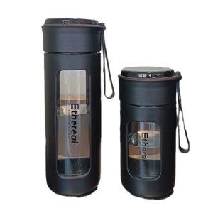 Minimalist matte black portable glass water bottles with tea filter and carry rope