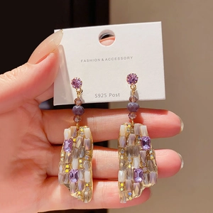 Detail of S925 silver needle purple crystal drop earring with patchwork design