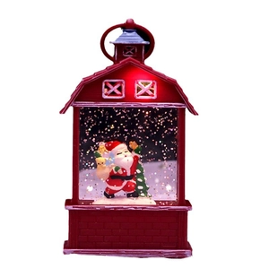 Red barn-shaped Christmas lantern with Santa Claus and sparkling glitter liquid inside