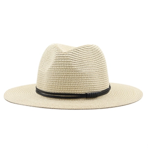 Detail of fine straw weaving and black decorative band on a summer Panama hat