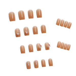 Nude pink gradient press-on nails with 3D butterfly and pearl accents, 24 piece set