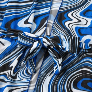 Detail of blue marble striped mesh fabric and waist tie-up knot of the bikini set
