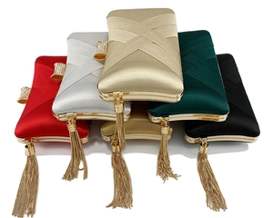 Detail of five assorted evening clutch bags with tassel fringe and rhinestone clasps