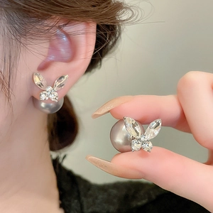 Elegant butterfly stud earrings with sparkling crystals and grey faux pearl backings