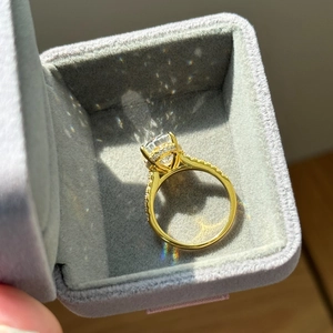 Close-up of luxury gold-plated S925 ring with oval ice cut zircon in a velvet box