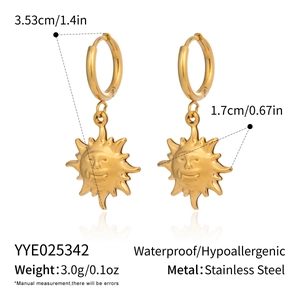 Detail view of gold stainless steel sun face drop earrings with size measurements